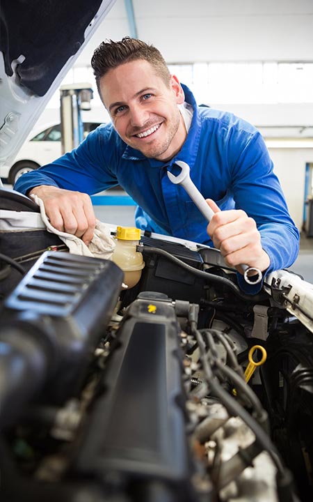 Photo of mechanic fixing a car