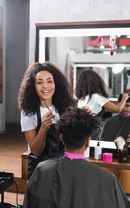 Photo of hair dresser cutting clients hair